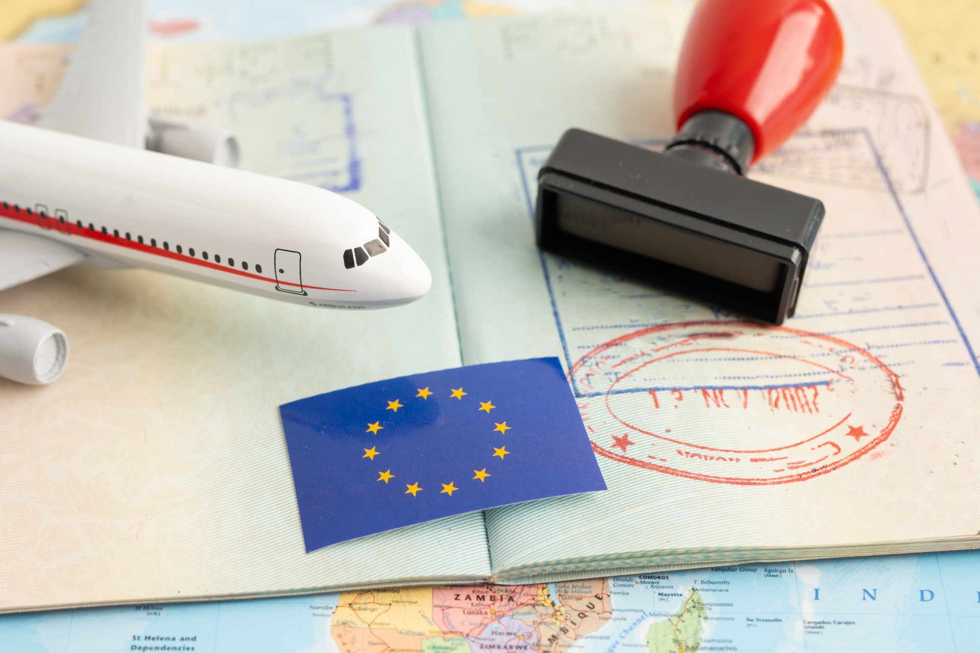 Approved Stamp passport with EU flag document to immigration at airport in country.